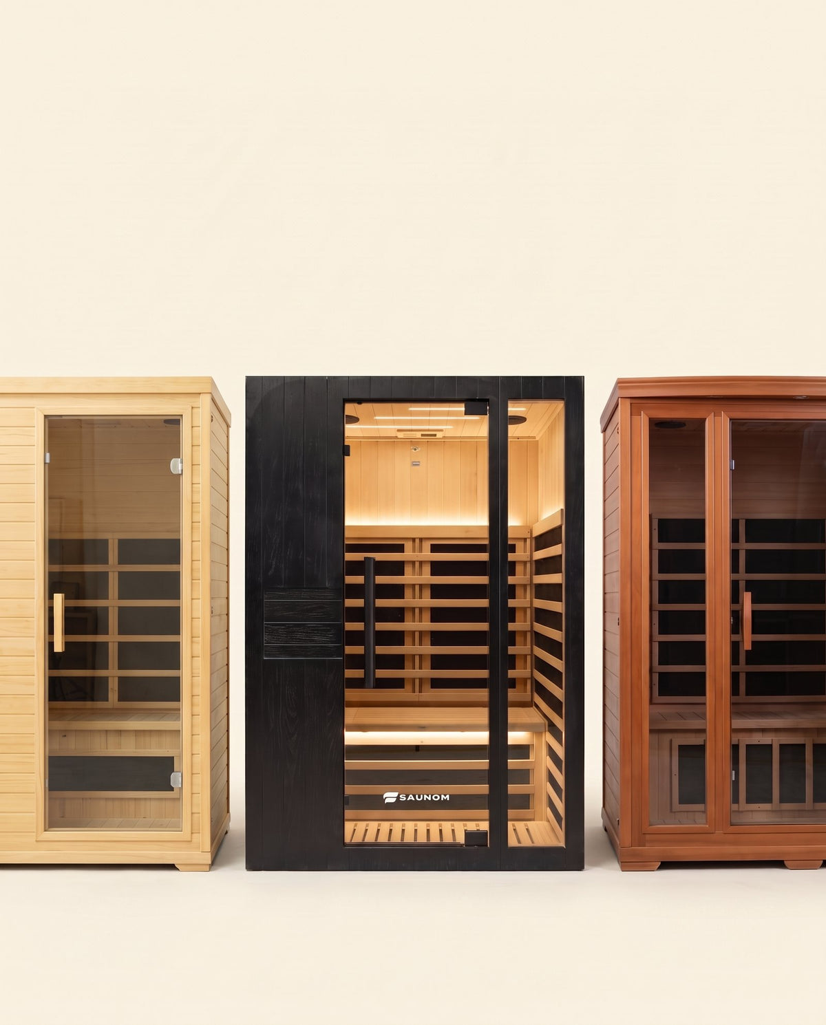 Black Saunom infrared sauna between a pine budget cabin and a large cedar cabin