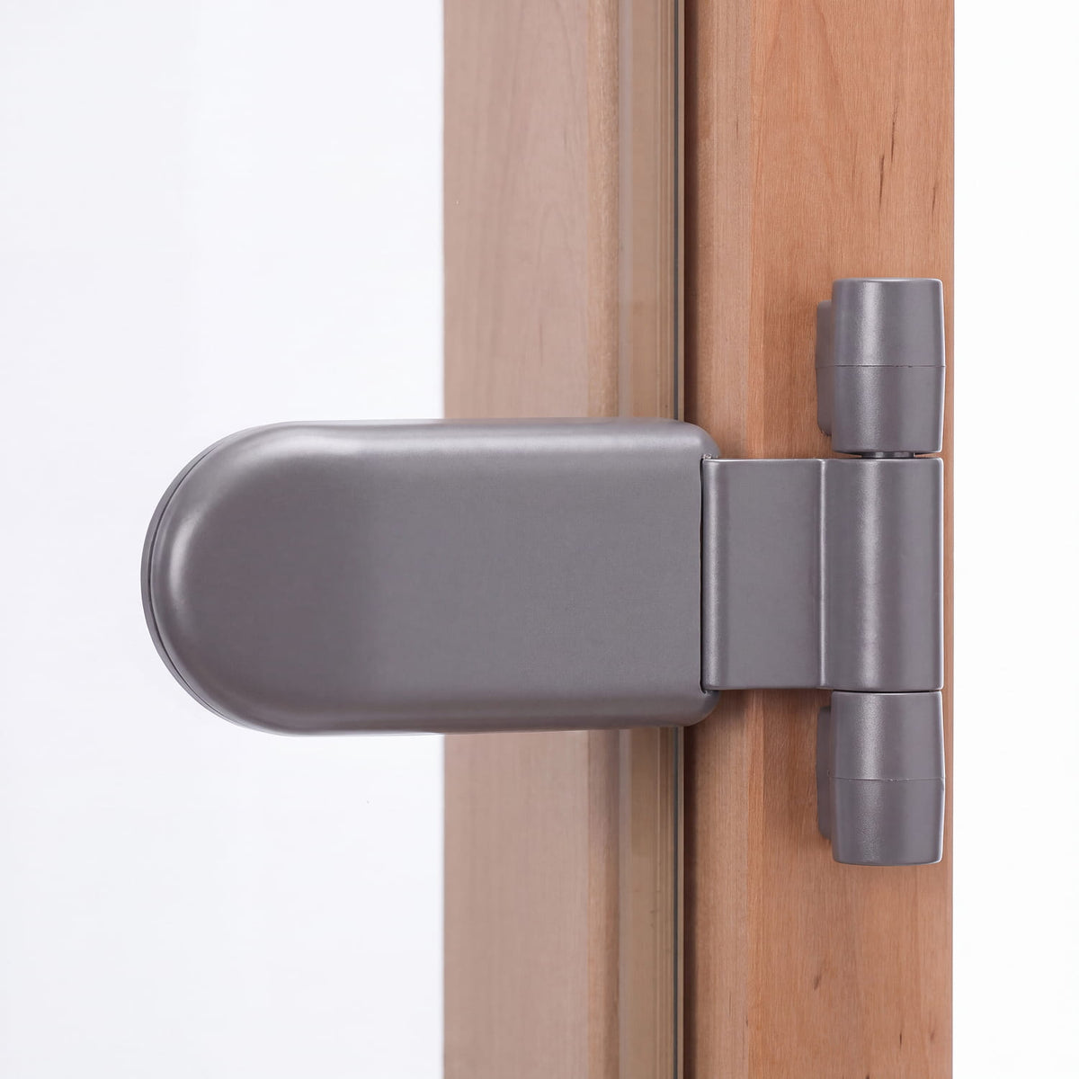 Grey metal sauna door hinge on the Portti clear glass sauna door with alder frame