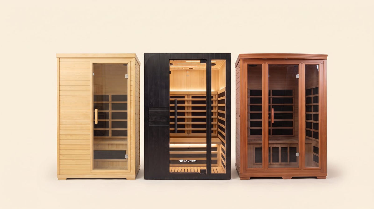 Black Saunom infrared sauna between a pine budget cabin and a large cedar cabin