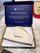 White wool sauna hat displayed inside an open branded gift box