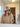 Woman taking a mirror selfie while wearing a grey wool sauna hat after sauna