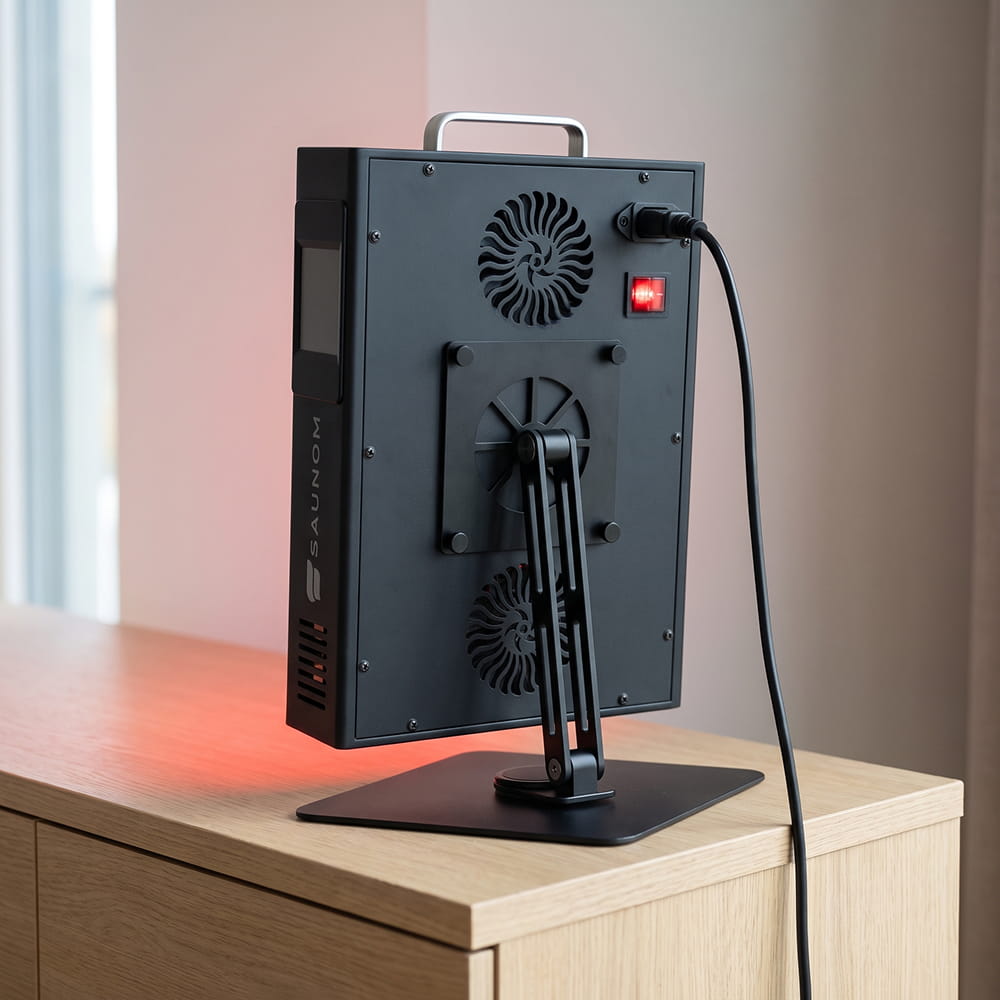 Back of the Saunom EW300 Pro red light therapy panel with two cooling fans, power switch and stand mount