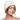 Close-up portrait of a woman wearing a white merino wool sauna beanie with eyes closed