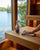 Saunom ready-to-use cleaner on a sauna wood bench