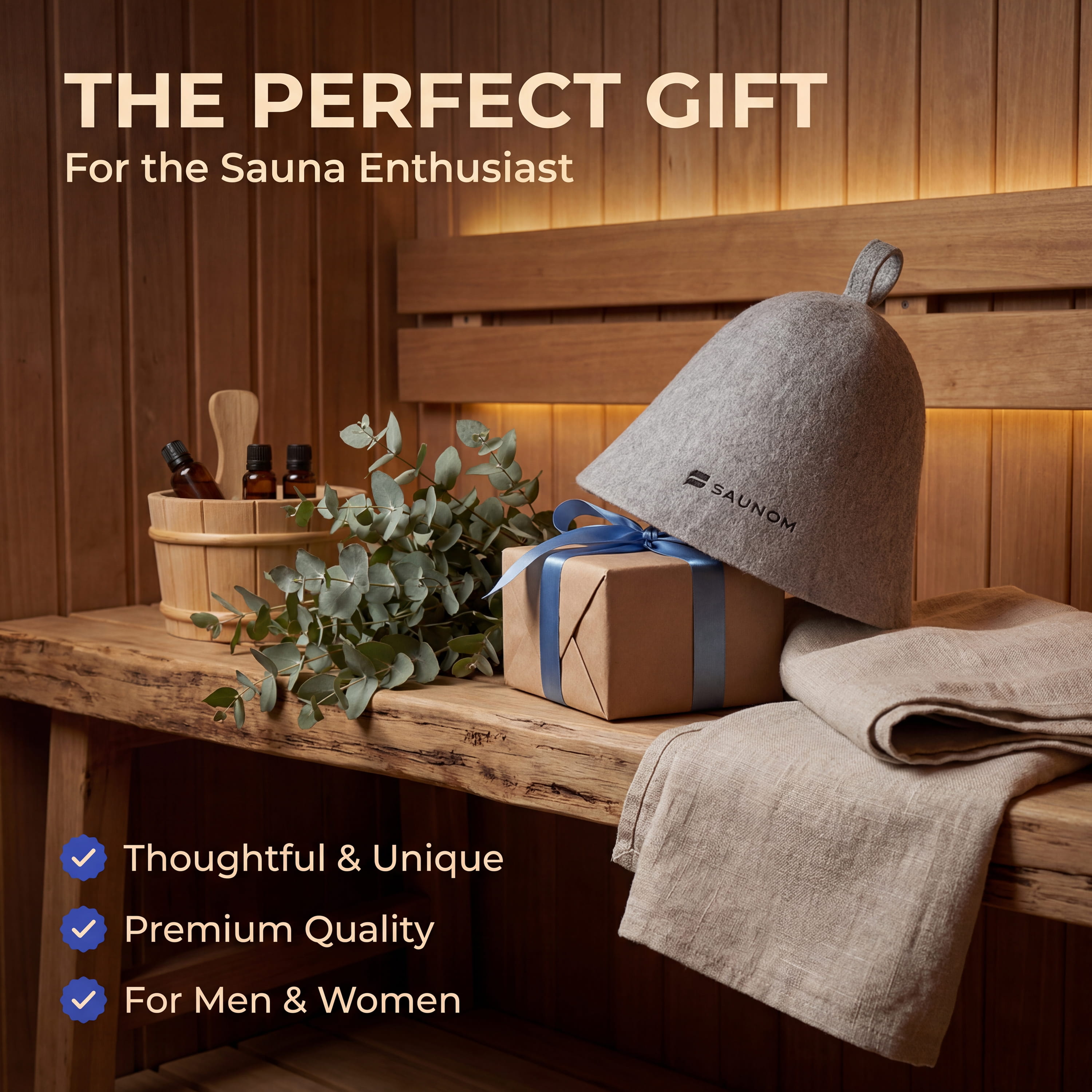 Gift-themed sauna product graphic showing a grey SAUNOM wool sauna hat with wrapped gift, towel, eucalyptus, and sauna accessories