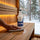 Wiping a cool sauna bench clean with a cloth and diluted Saunom sauna cleaner