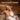 Couple wearing white merino wool sauna hats in a traditional sauna